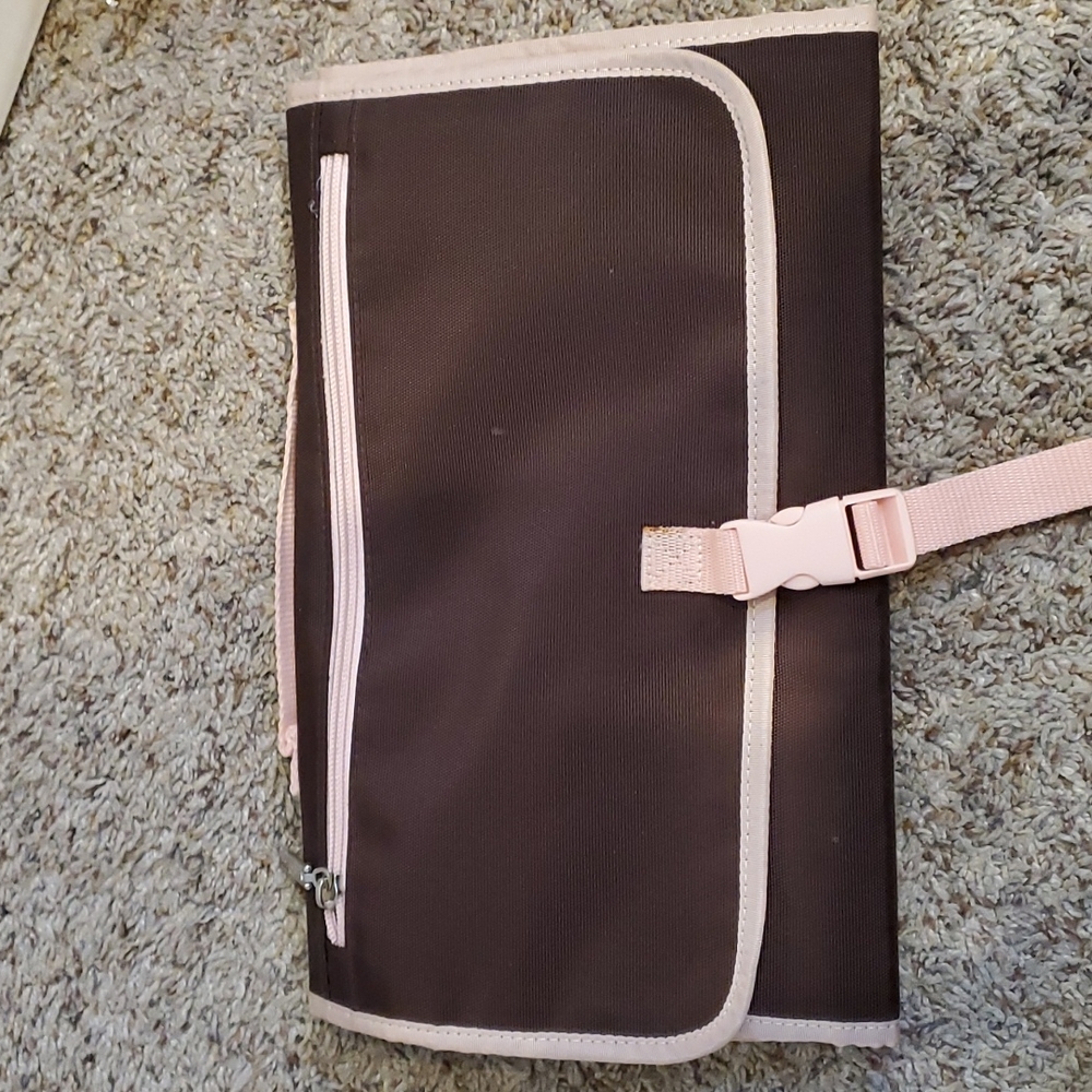 Pink and brown changing pad